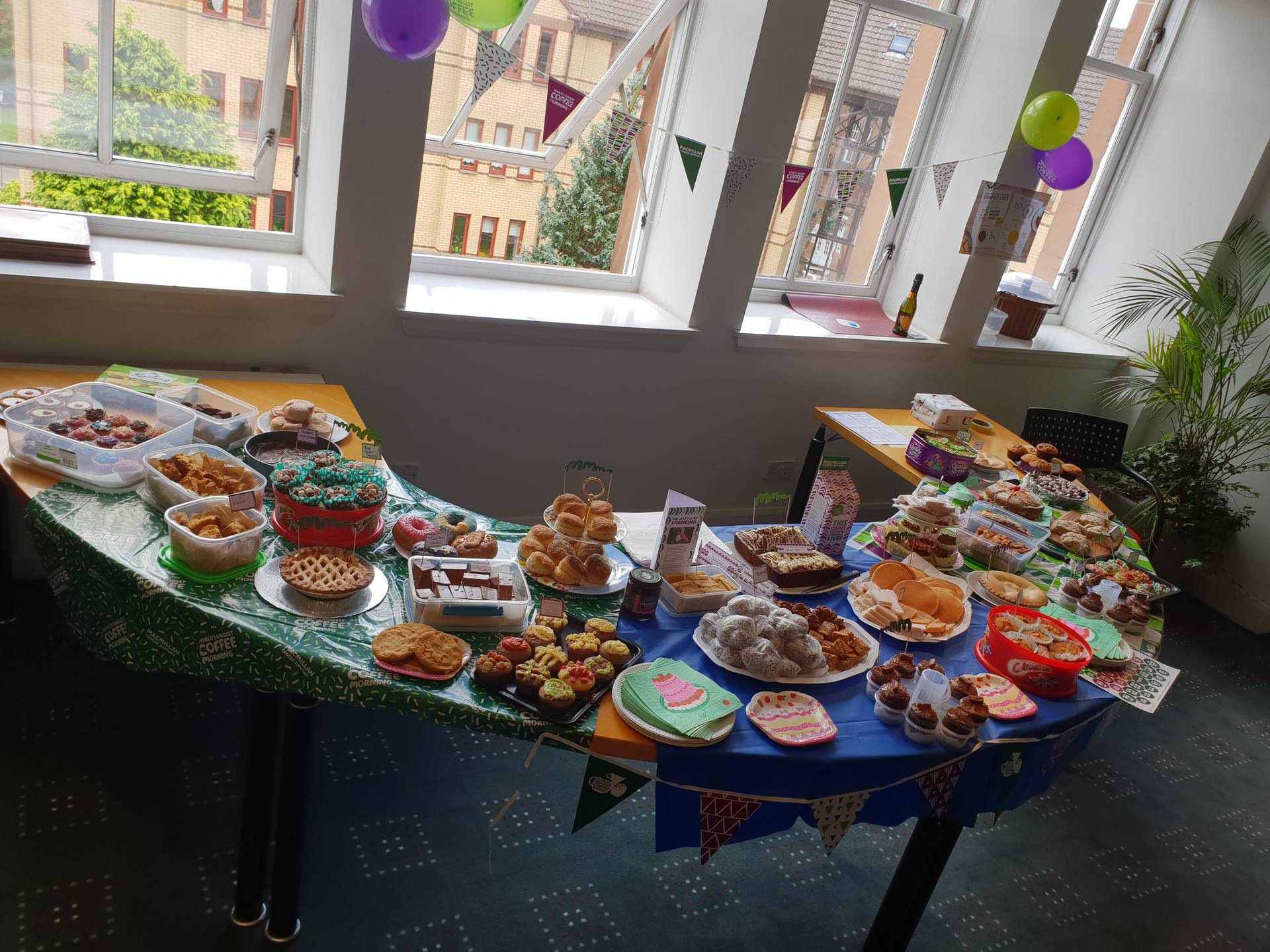 McMillian Coffee Morning Hosted by CRGP, showing the assortment of home baked goods the team brought to raise money for charity