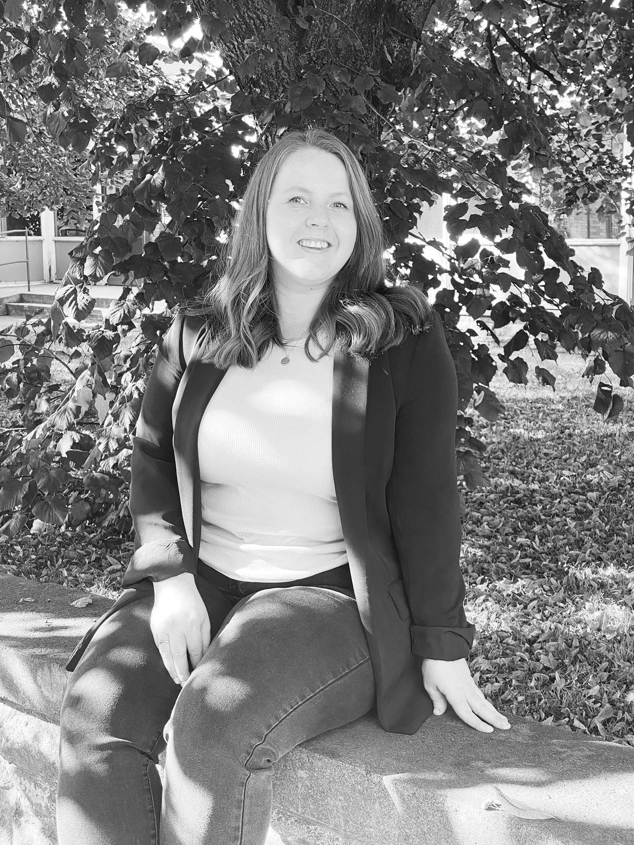 Image of Jenna Sherriff sitting on a wall